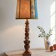 Renaissance table lamp in polychrome carved wood with cherubs.