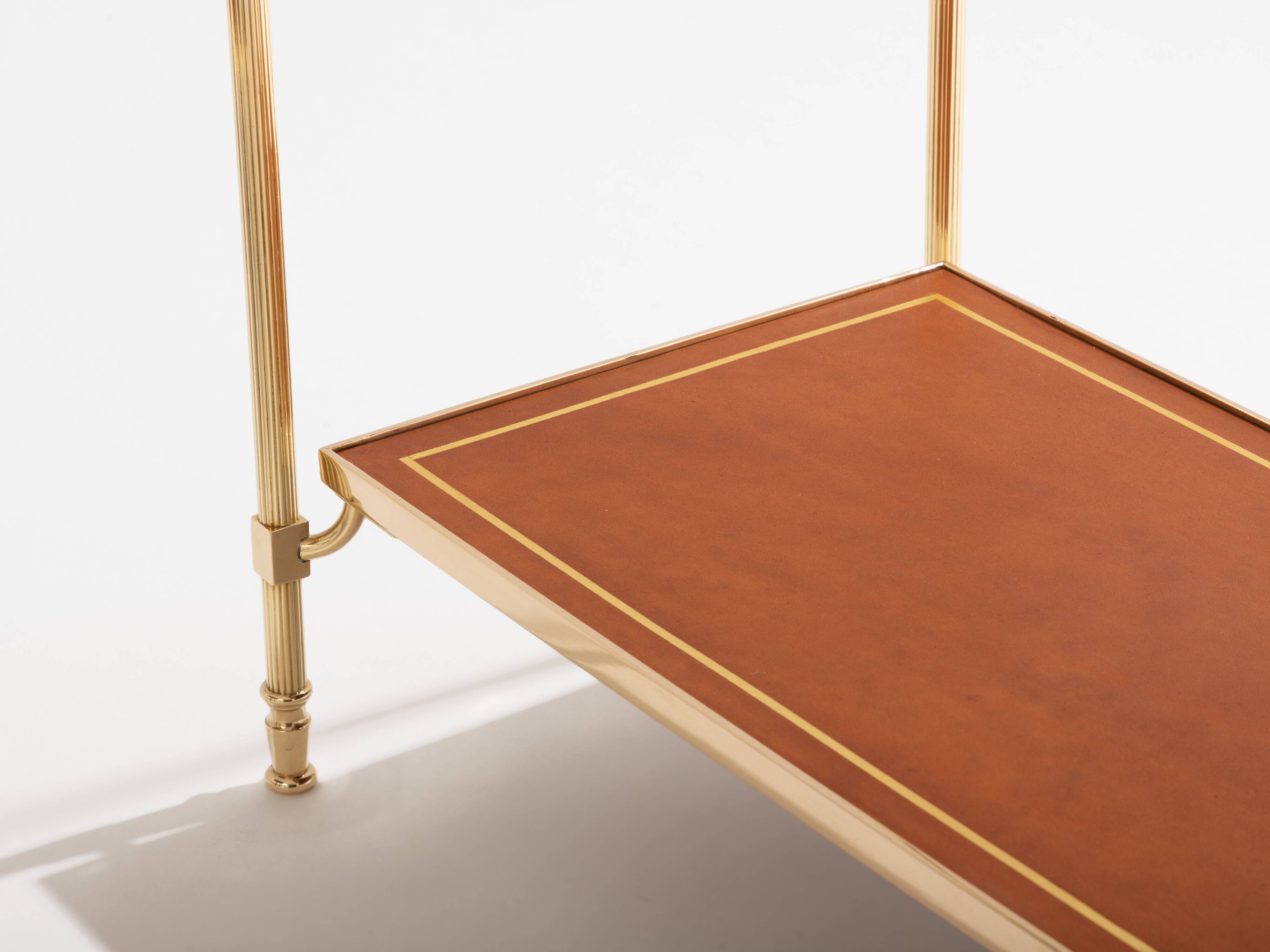 Pair of neoclassical brass and leather side tables by Maison Jansen, 1960