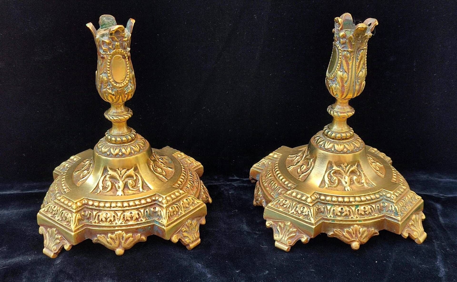 Pair of antique carved bronze candlesticks.