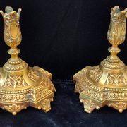Pair of antique carved bronze candlesticks.
