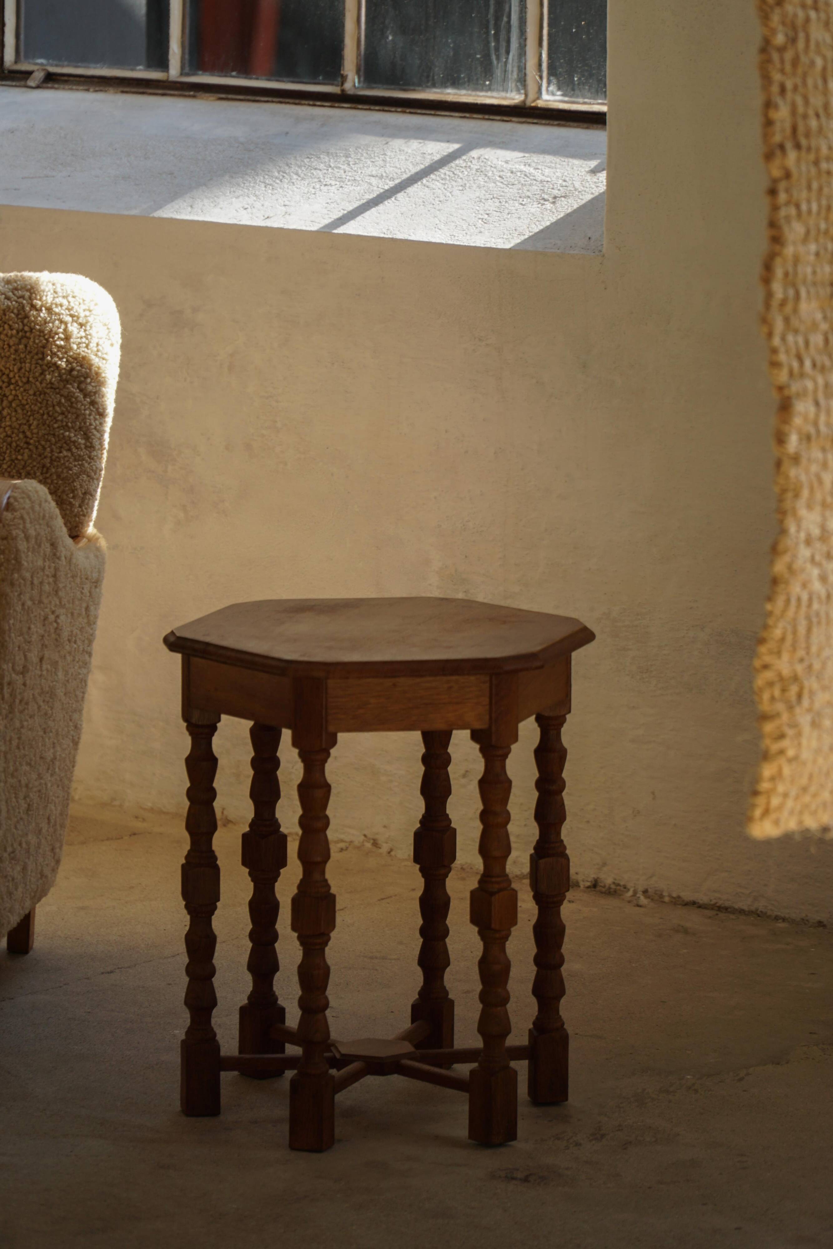 Danish hexagonal side table in oak with turned legs, 1950s.