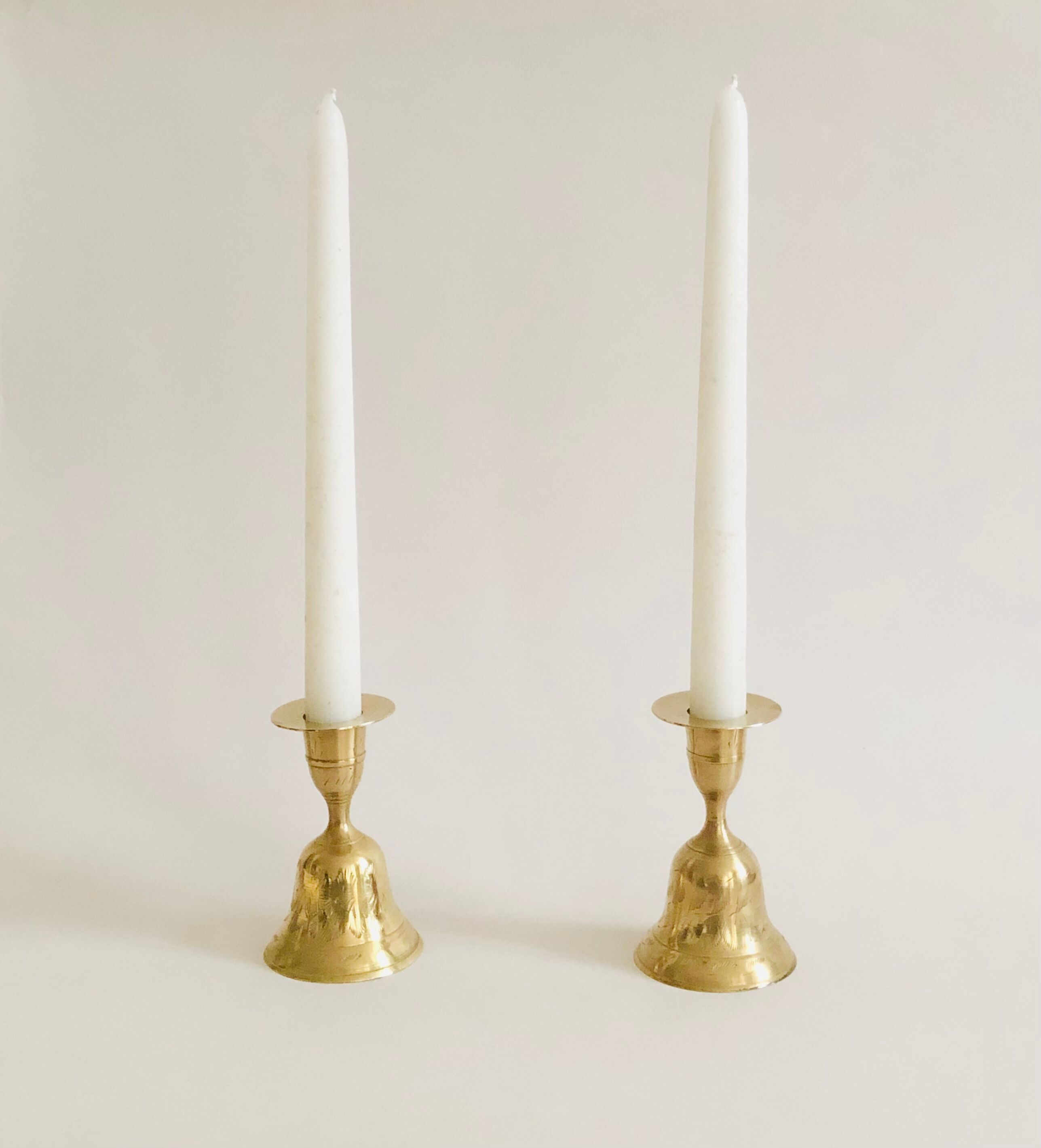 Pair of brass "bell" candle holders