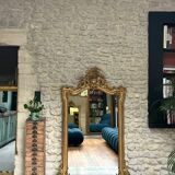 Antique mirror 169/105cm with pediments and pearl detailing in gold leaf.