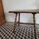 Brutalist coffee table with turned wooden legs