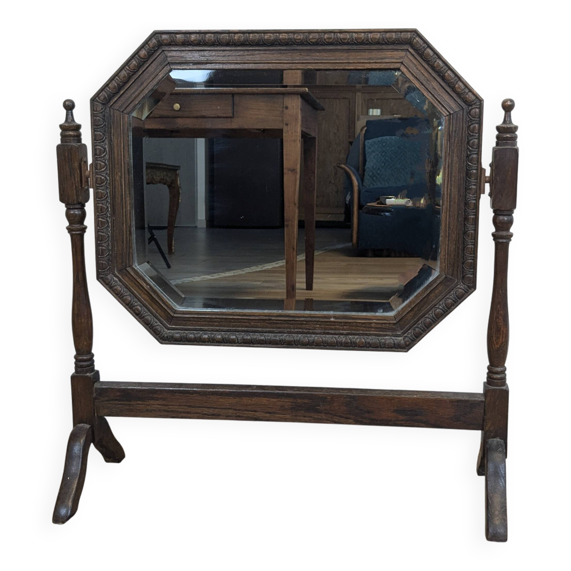 Antique beveled octagonal vanity mirror in carved wood