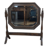 Antique beveled octagonal vanity mirror in carved wood
