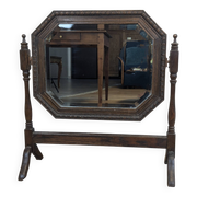 Antique beveled octagonal vanity mirror in carved wood