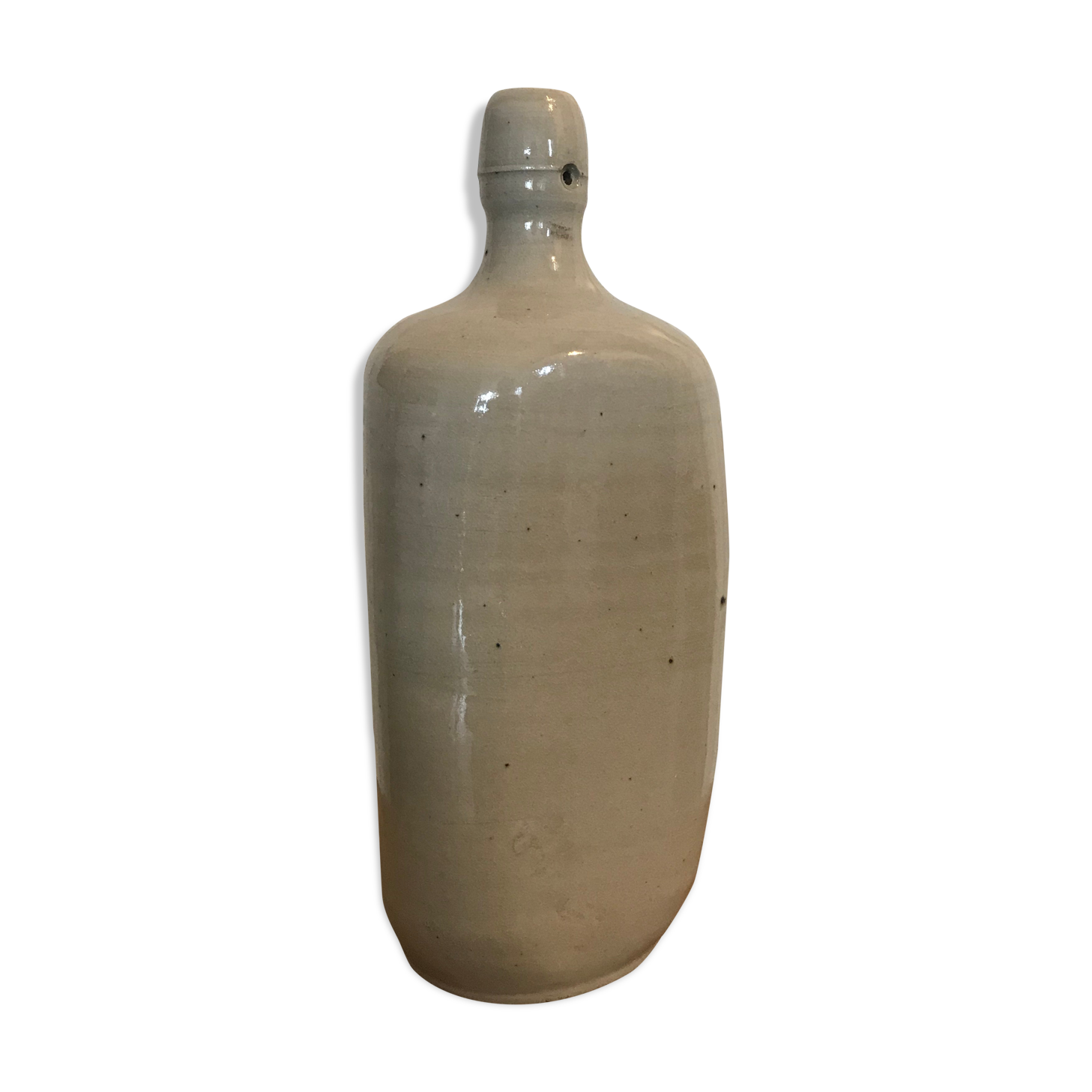 Old light grey ceramic bottle