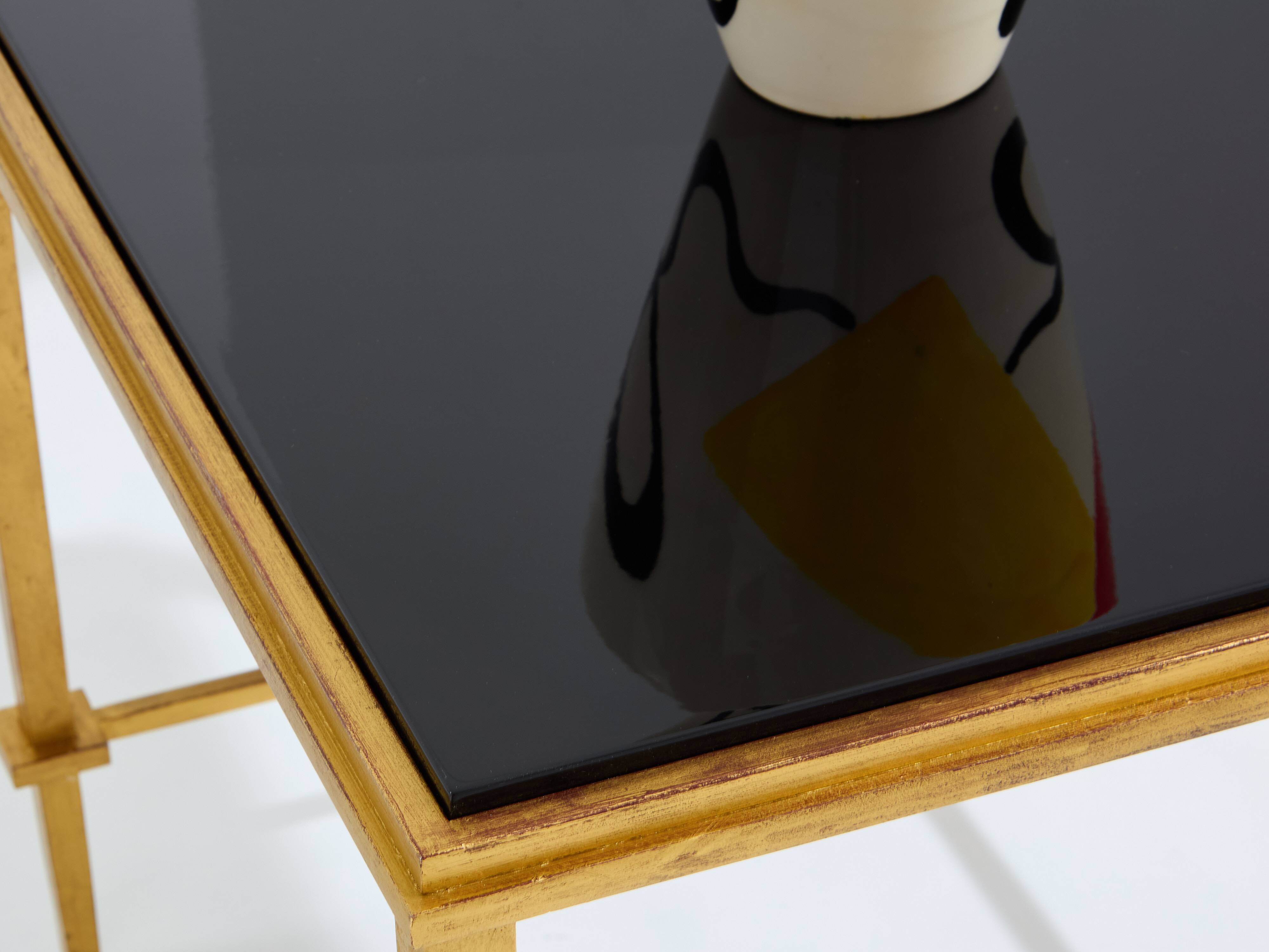 Pair of side tables in gilded iron and black lacquer Maison Ramsay 1950