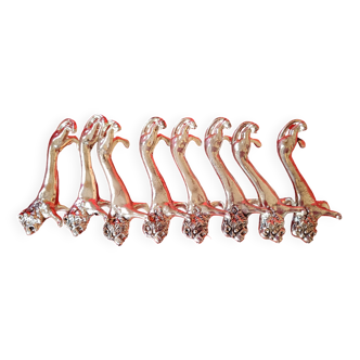Set of 8 silver metal knife holders. Lion shape.