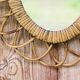 Vintage oval rattan mirror from the 60s/70s.