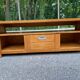 Solid pine wood TV unit stained with drawer and storage.