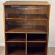 Teak bookshelf, sliding display + open storage, 60s/70s