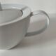 Graphic teapot in white porcelain with a minimalist design.