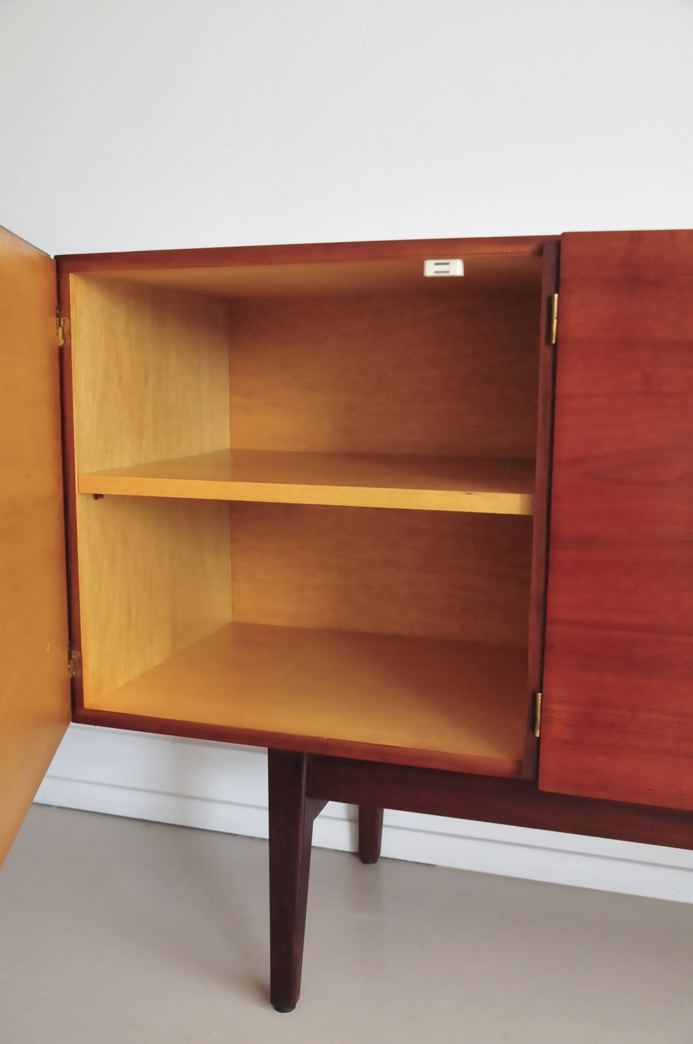 vintage Danish sideboard with black and white drawers