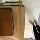 Antique carved wooden dressing table with marble and tilting oval mirror.