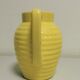 Yellow pitcher in slurry, faience onnaing frères
