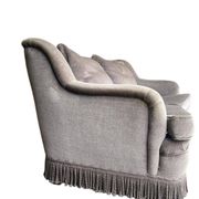 Vintage taupe two-seater armchair/sofa with fringes.