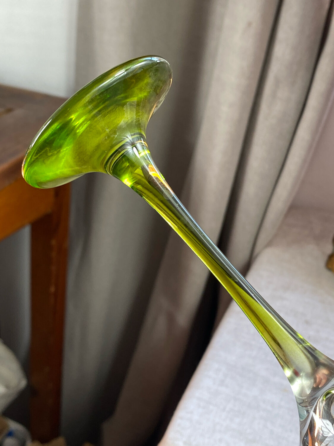 Champagne coupes in glass, multicoloured stems.
