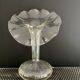 Vintage transparent glass vase in flower shape.