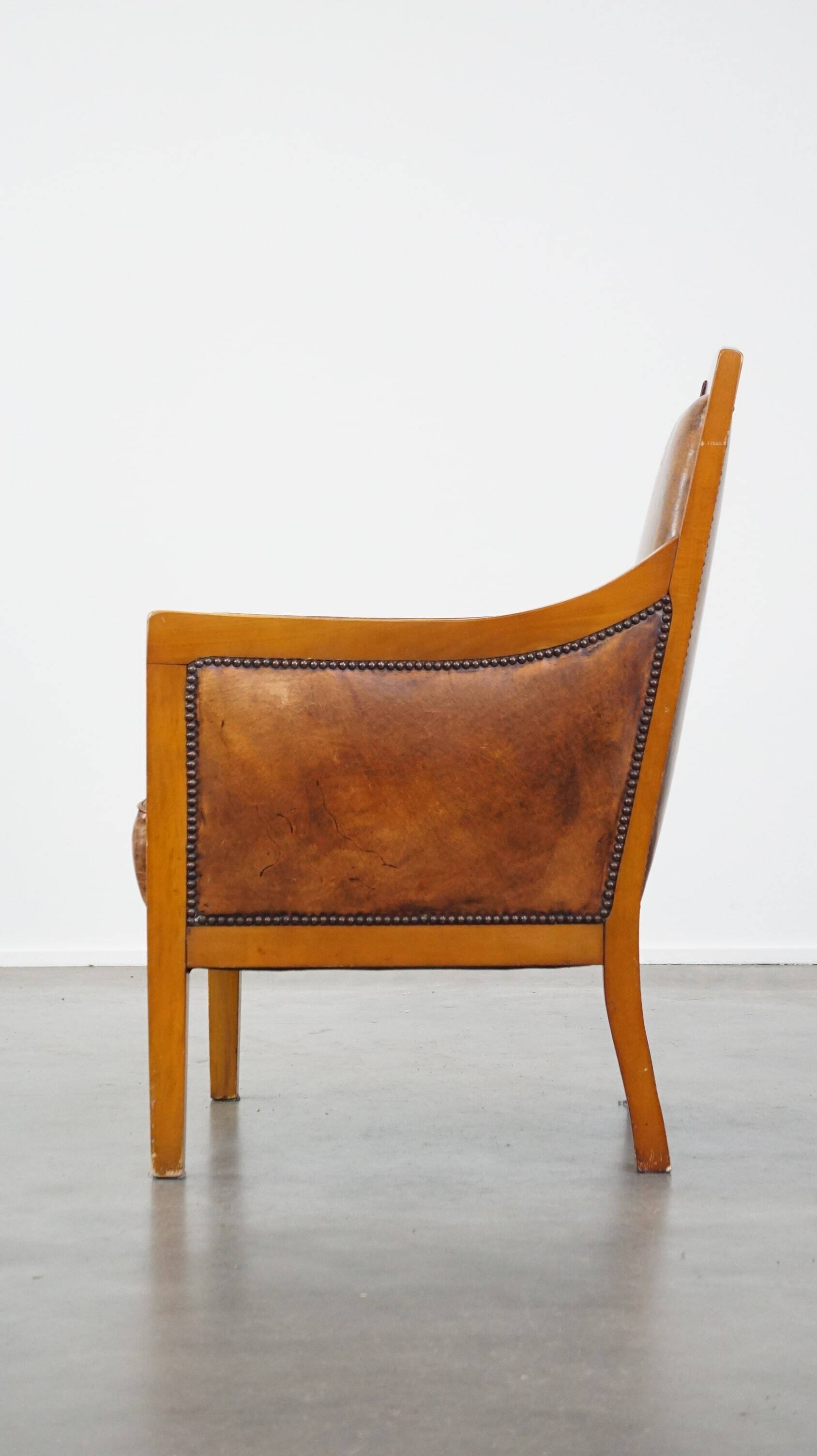 Sheep leather Art Deco design armchair combined with wood