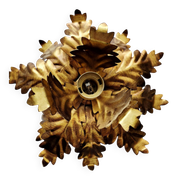 Vintage floral metal applique in gold.