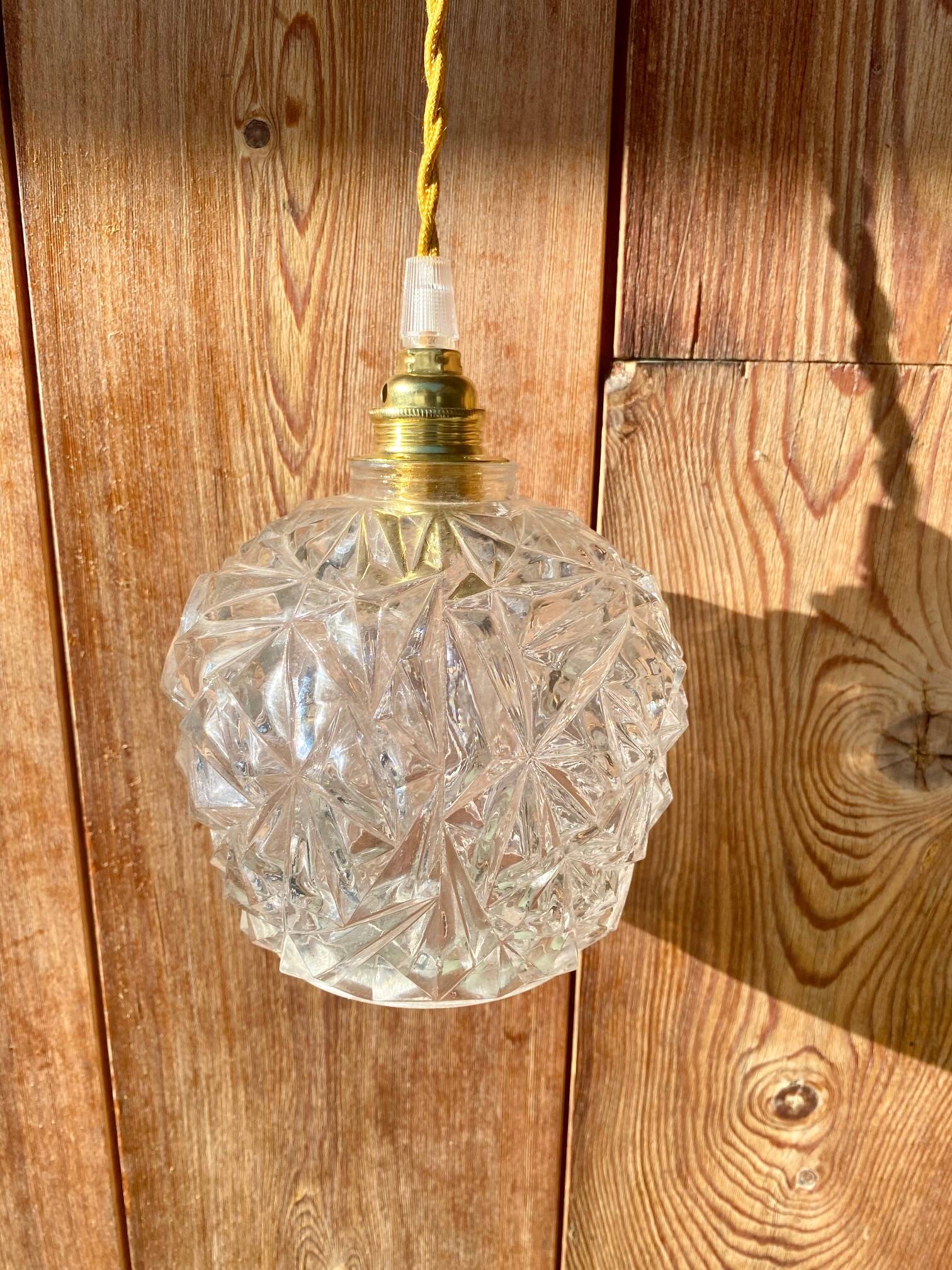 Globe pendant light in chiseled glass