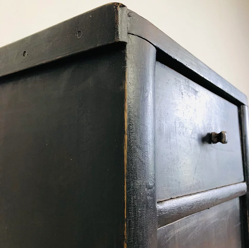 Antique black patinated bedside table