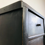 Antique black patinated bedside table