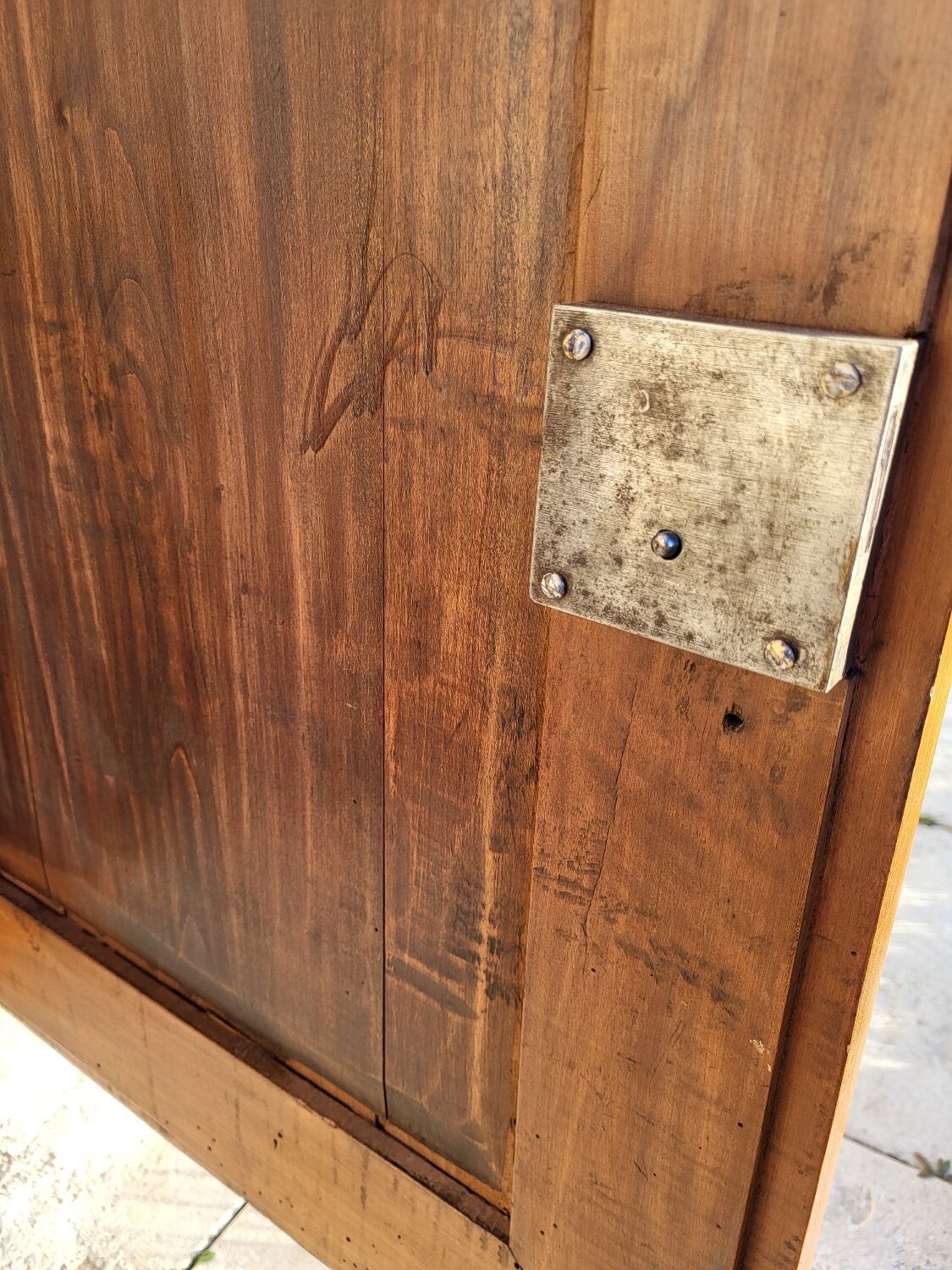 Furniture with a cherry wood door.