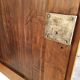 Furniture with a cherry wood door.