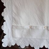 scalloped pillowcase decorated with a baron's crown