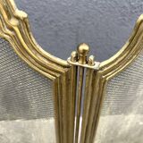 Antique brass fireplace screen from 1920, vintage spark guard.