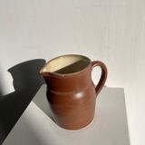 Pitcher in dark brown sandstone glazed with dotted frieze patterns