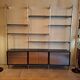 Wall shelves in wood, stainless steel and glass Roche Bobois