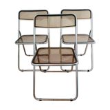 Trio of plexiglass folding chairs