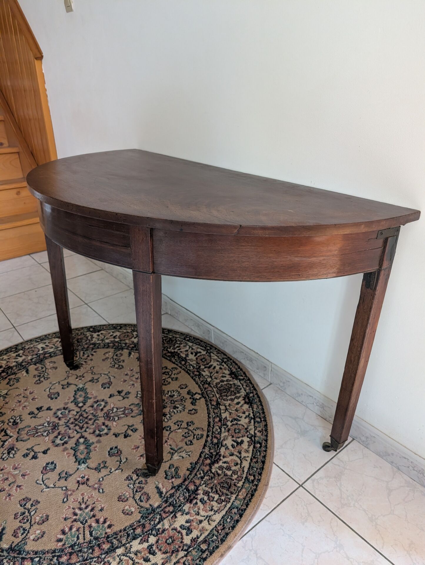 Old half-moon table or serving trolley on wheels