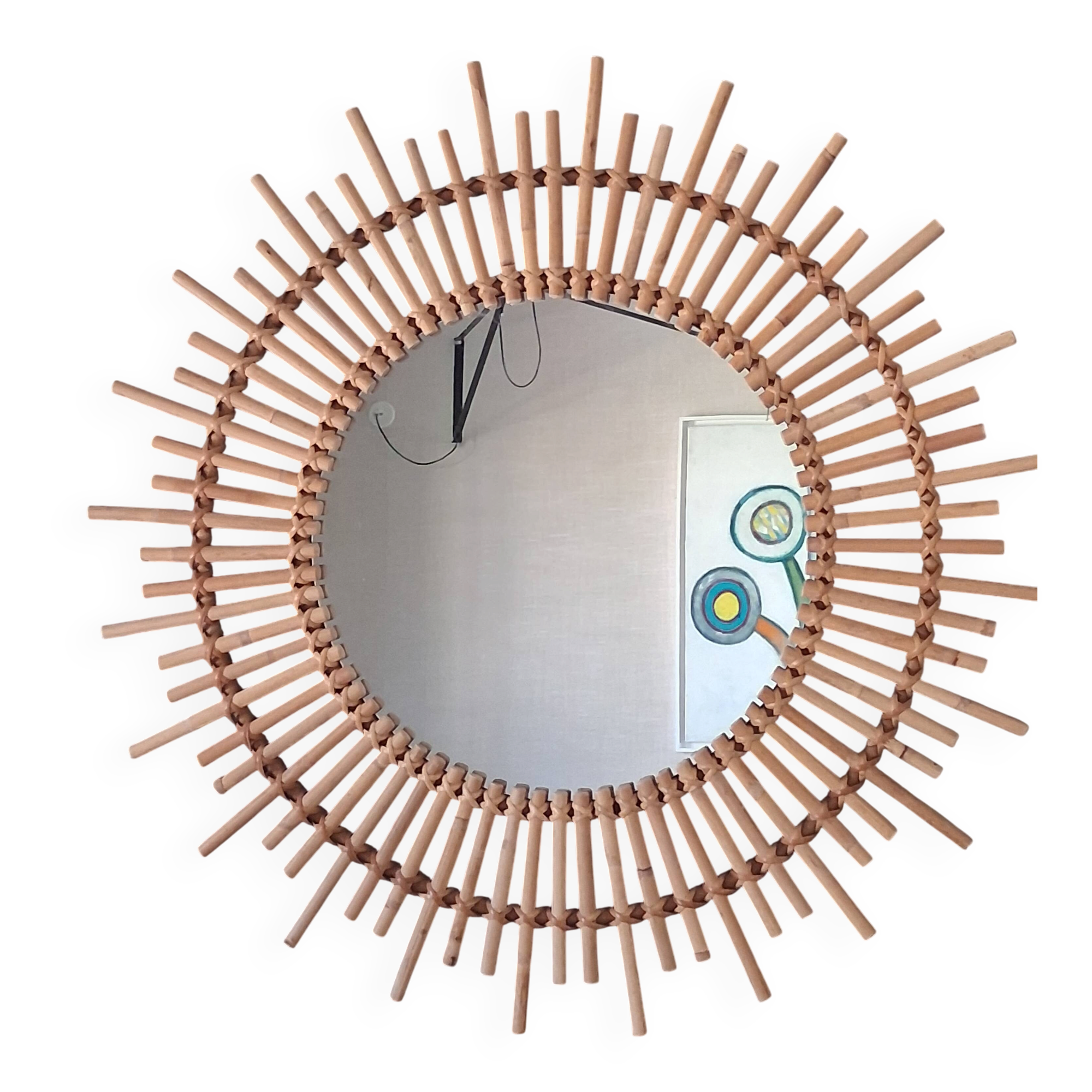 Very large sun mirror in rattan.