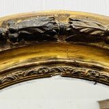 Large golden oval mirror