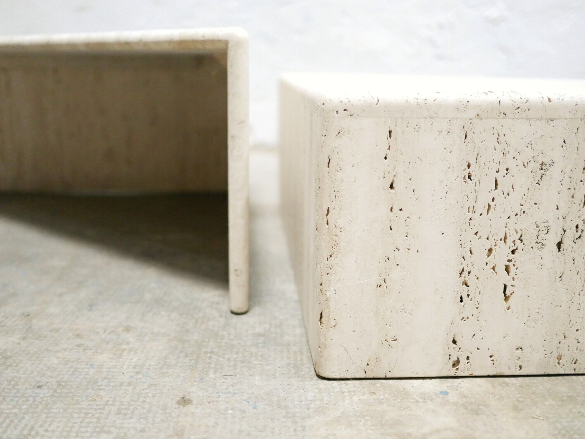 Series of 2 vintage travertine coffee tables published by Roche Bobois