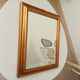 Miroir doré vintage à glace biseautée