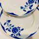 4 white porcelain plates with blue flowers