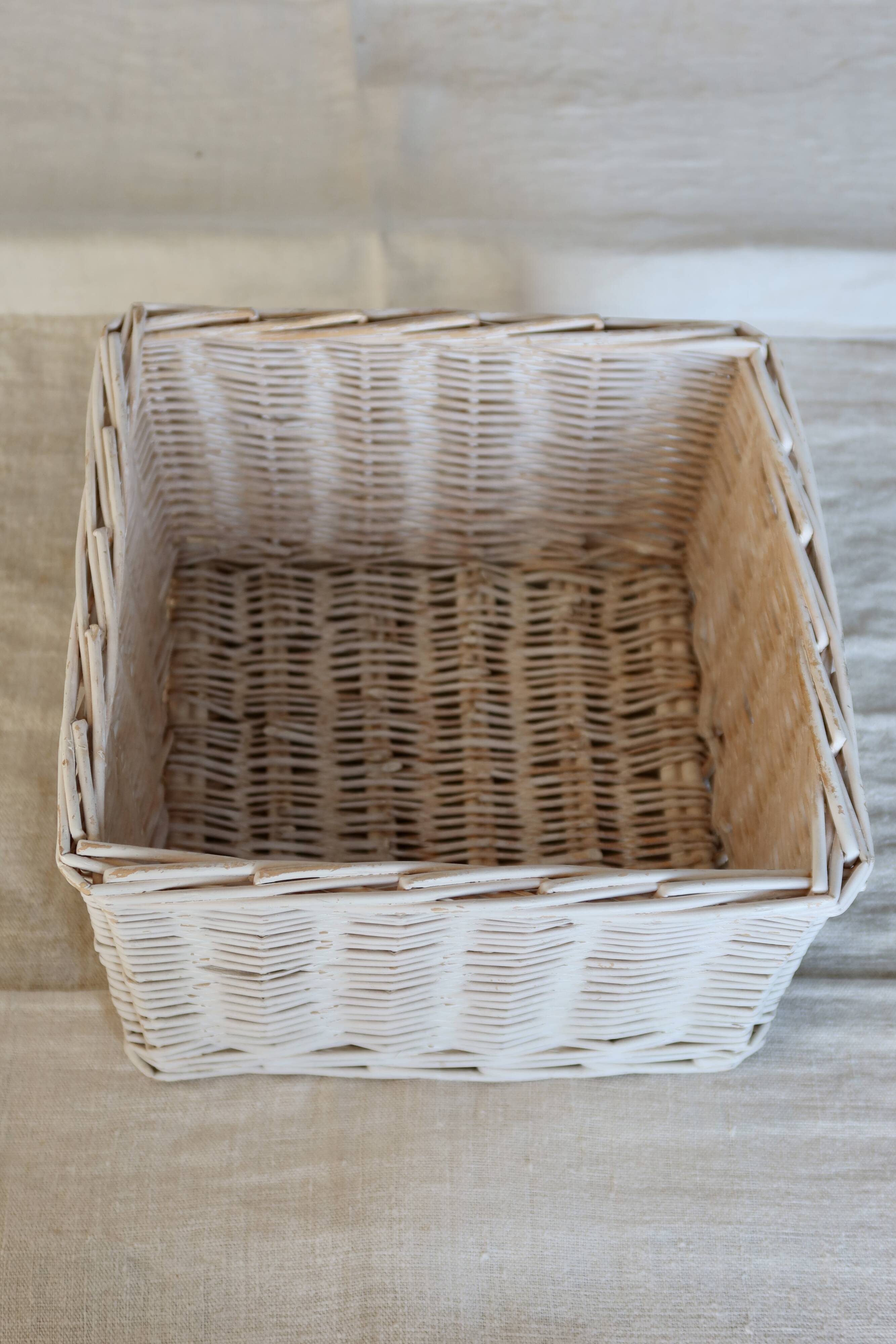 Vintage white wicker storage baskets
