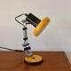 Articulated orange Aluminor desk lamp industrial design 70s