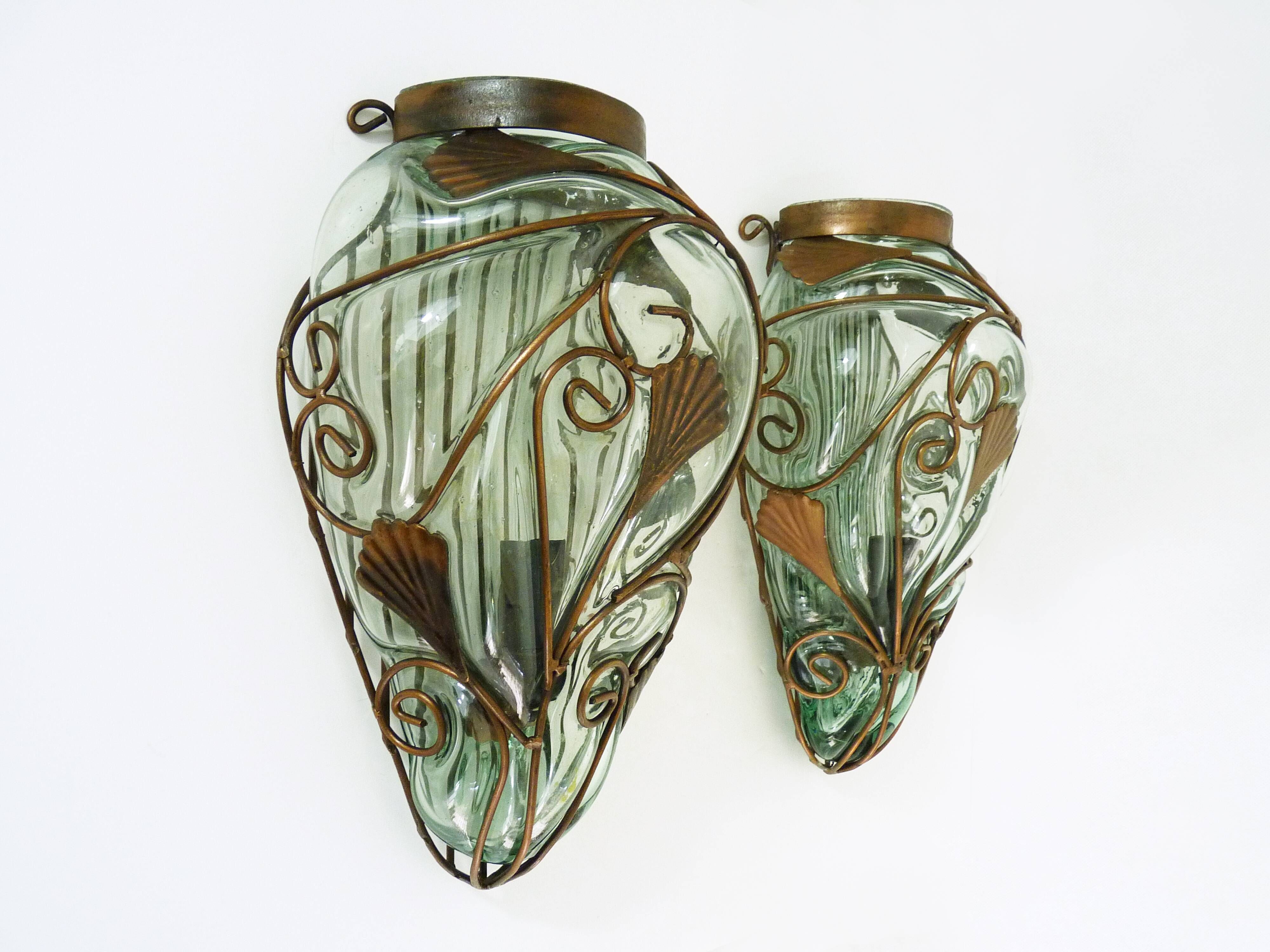 Pair of wall light cage in blown glass green color and wrought iron. Murano style. Year 80