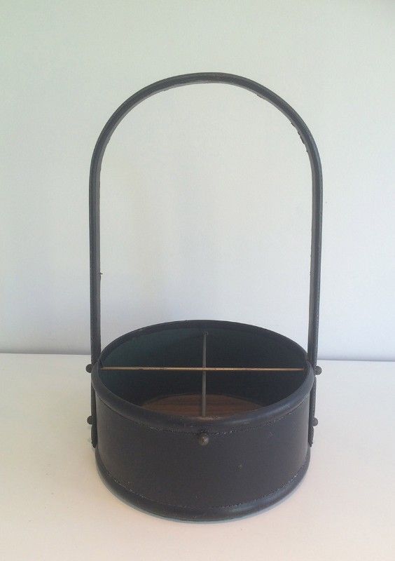 Leather wall magazine rack. In the style of Jacques Adnet.