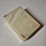 Rectangular light onyx jewellery box with brass trim, empty.