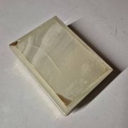 Rectangular light onyx jewellery box with brass trim, empty.