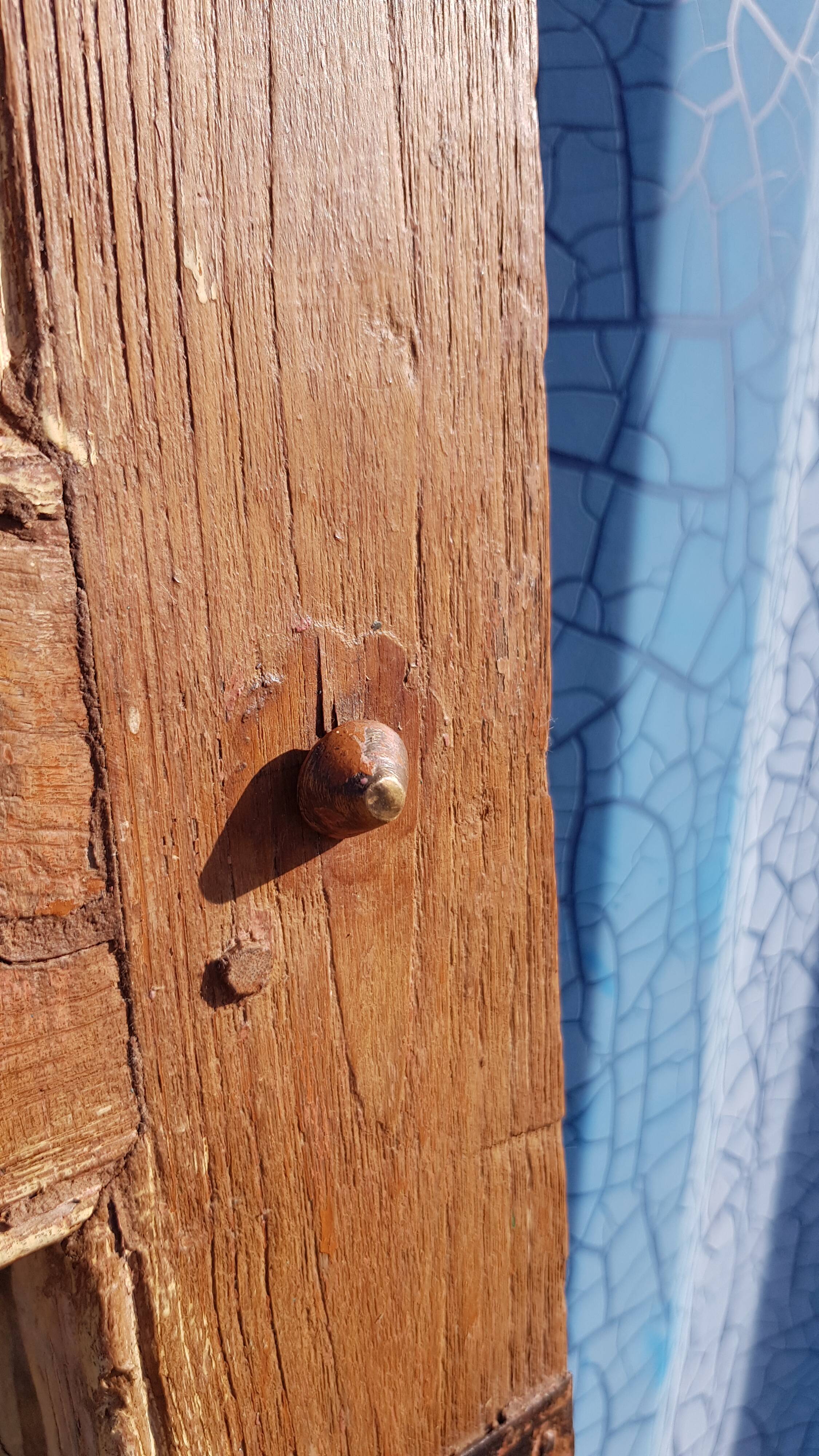 Old Burmese teak mirror with copper fittings