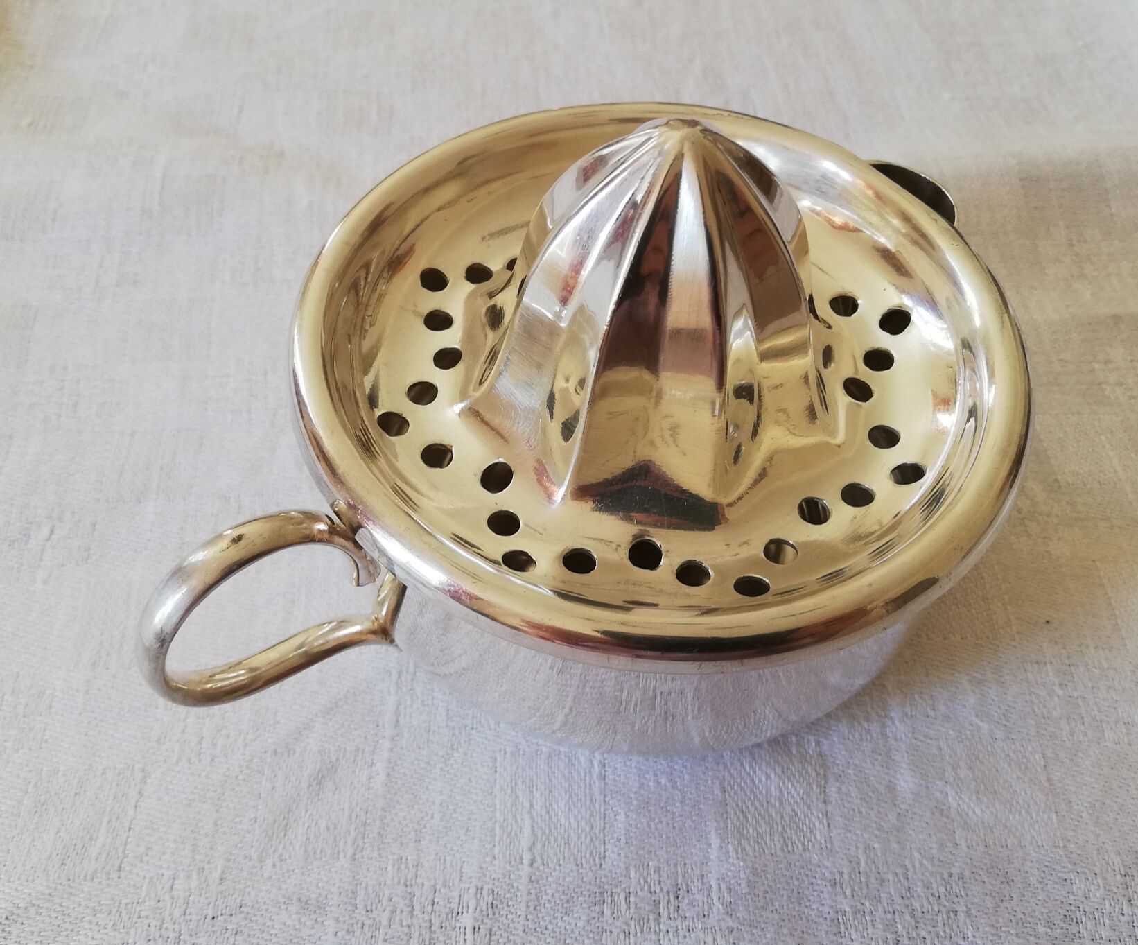 Silver metal citrus press Christofle